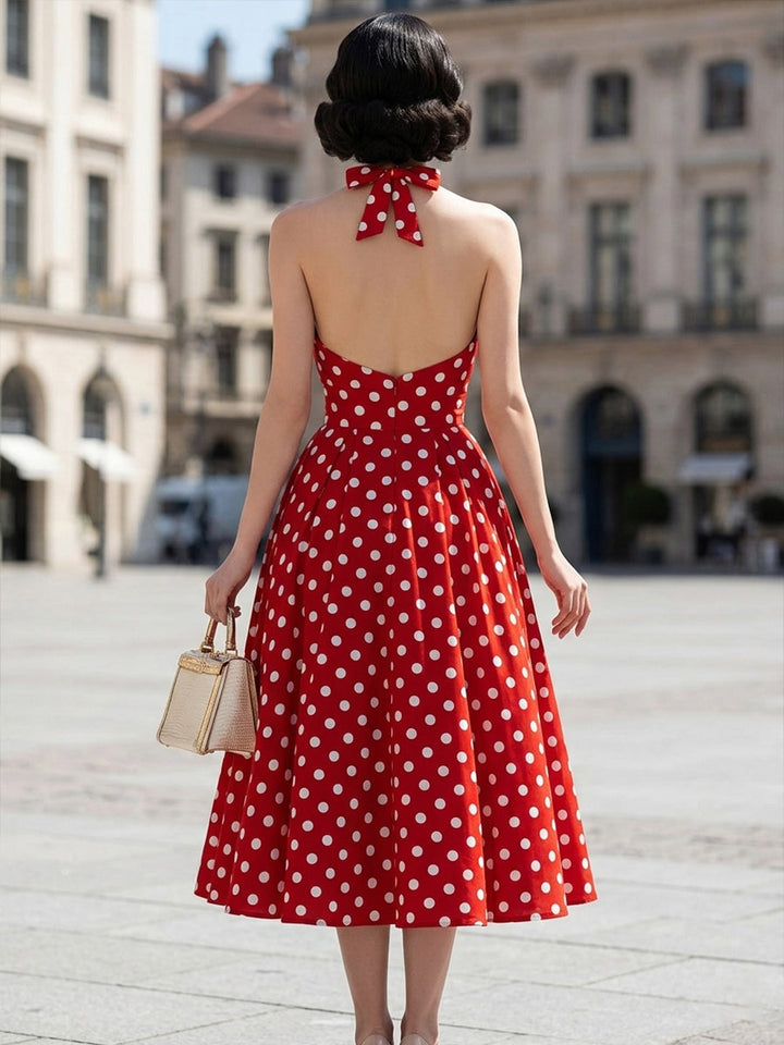 Rochie midi cu buline, decolteu tip halter și croială în formă de A