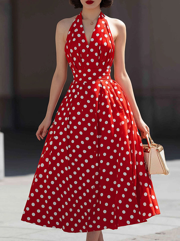 Rochie midi cu buline, decolteu tip halter și croială în formă de A